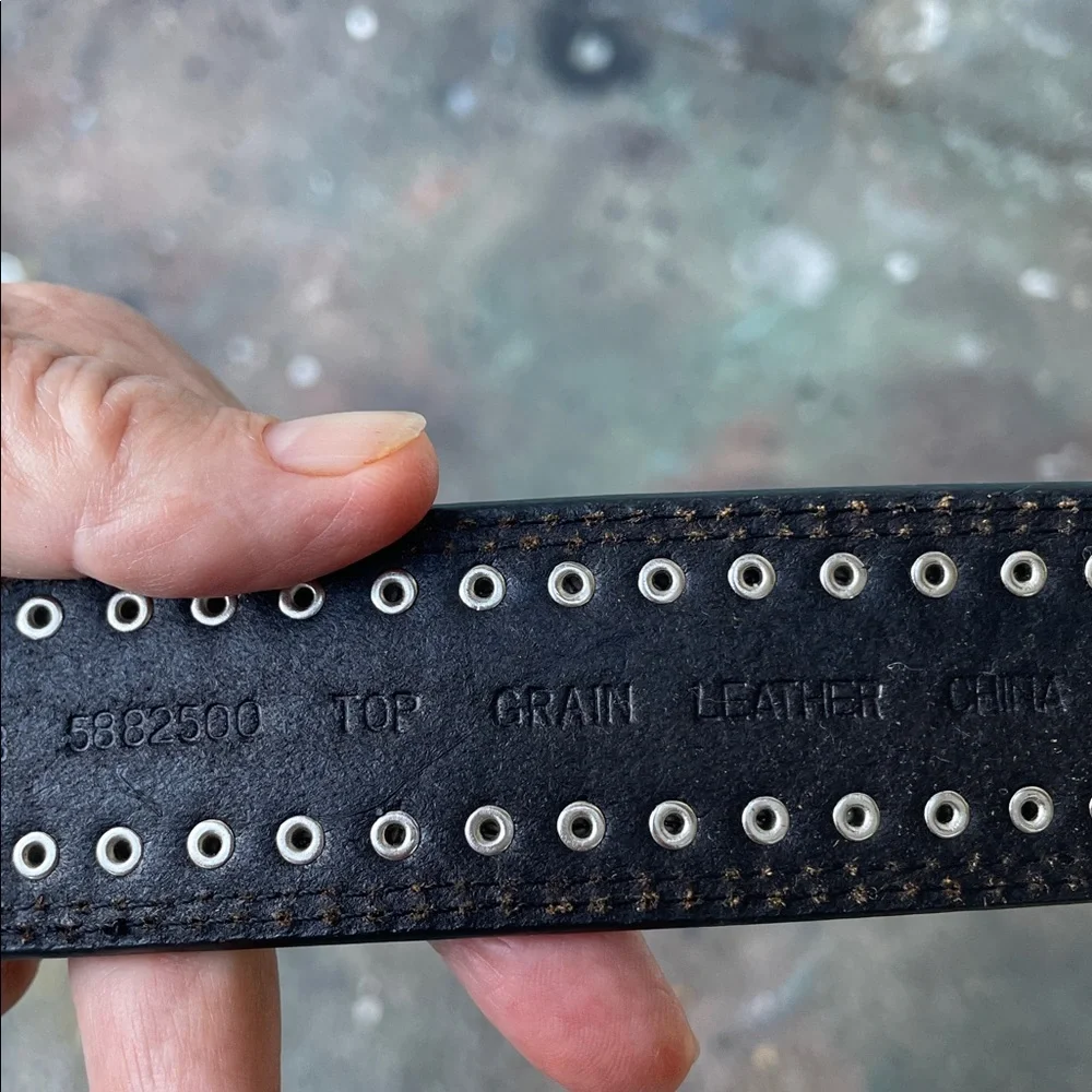 Engraved silver and studded, leather cowboy belt